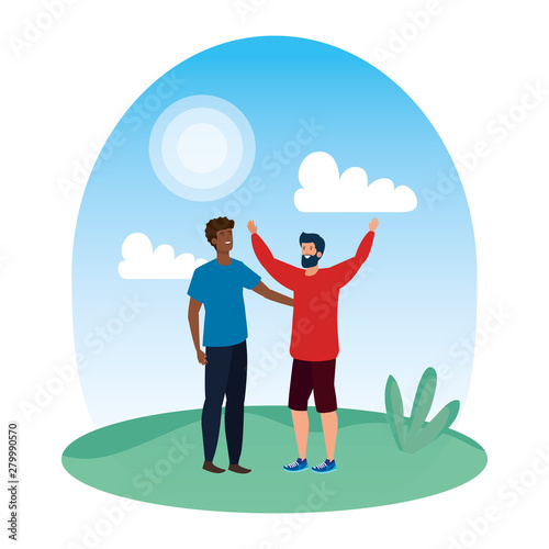 interracial young men friends celebrating in the park