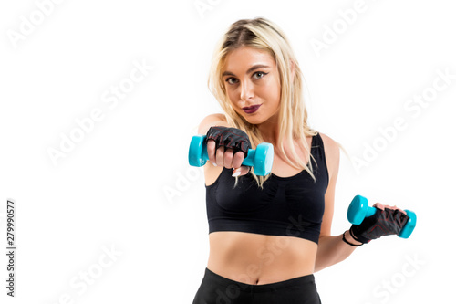 Beautiful fit woman exercising with dumbbells
