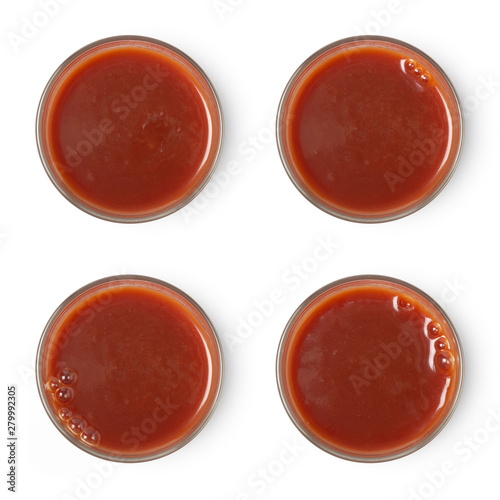 glass of tomato juice assortment isolated on white background, top view.