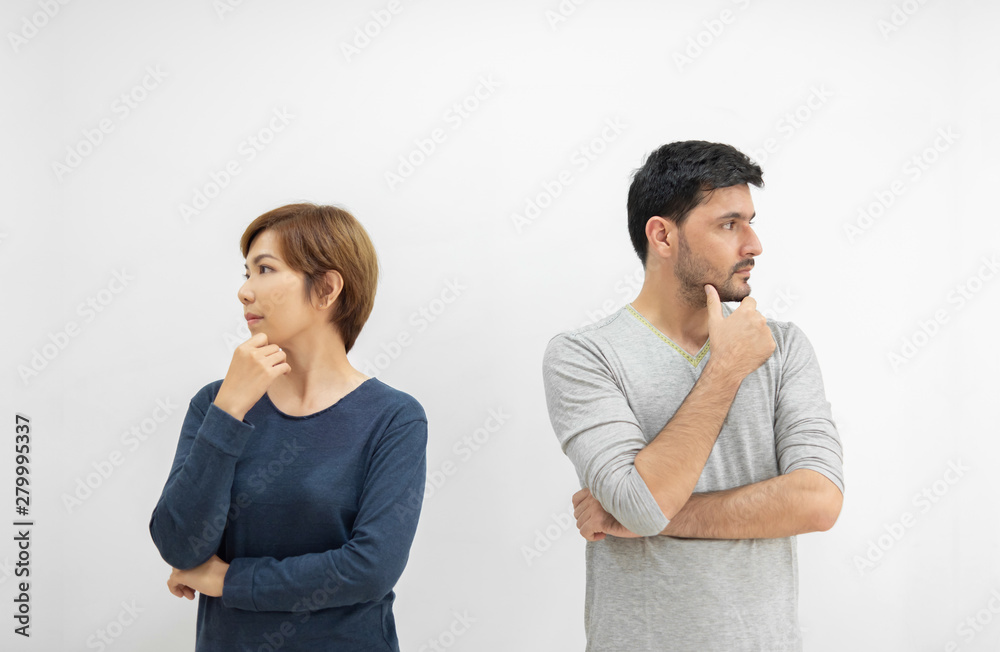 Couple standing with arms crossed and thinking something. Couple standing with arms crossed and thinking something.