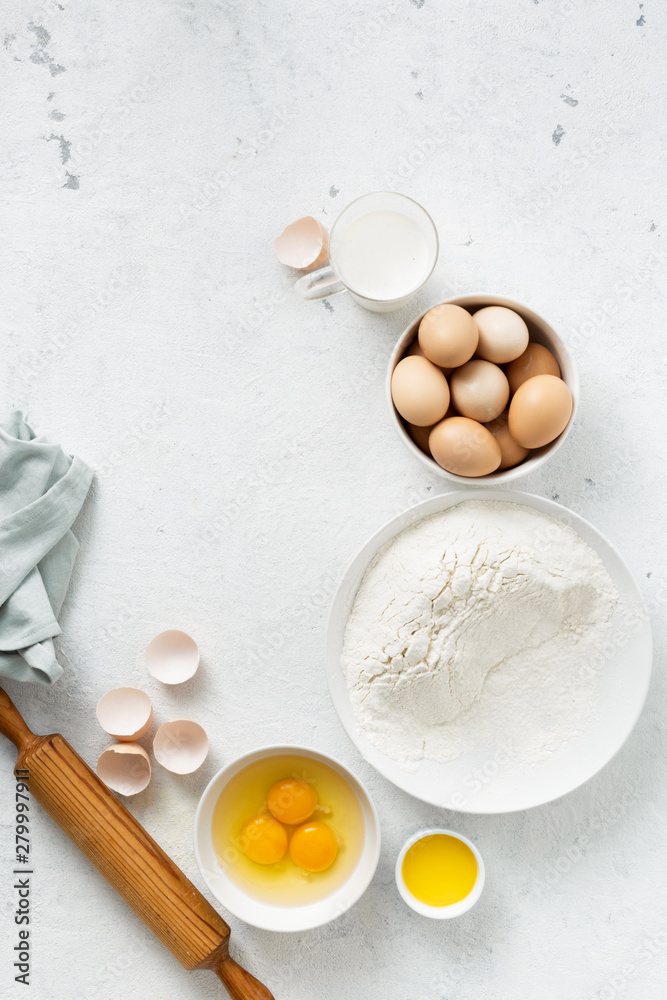 Dough ingredients on a white background top view Dough ingredients on a white background top view