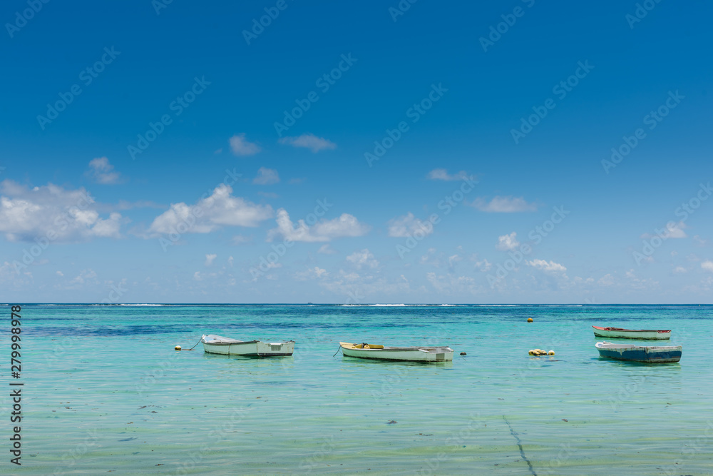 Many small boats near indian ocean coastline