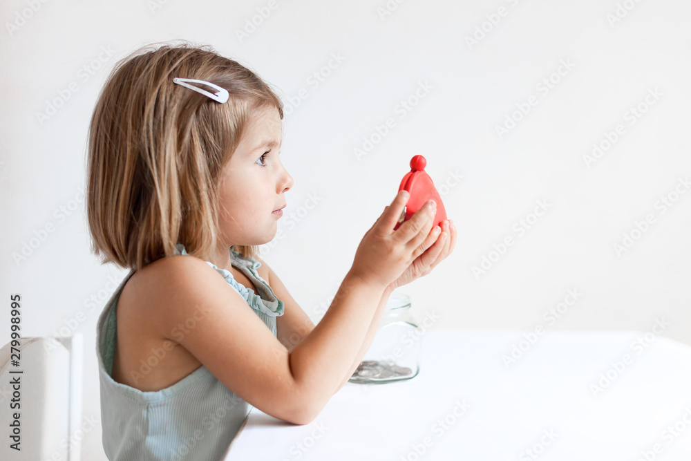Toddler girl with red wallet,purse play with coins at home Toddler girl with red wallet,purse play with coins at home