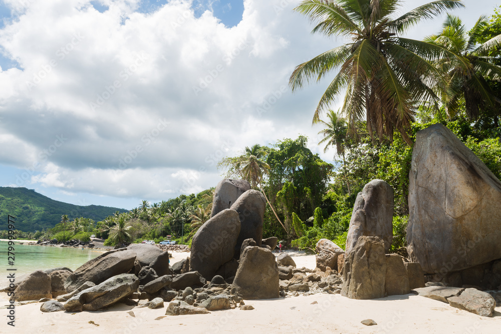 Big rocks on sandy Seychelles beach landscape