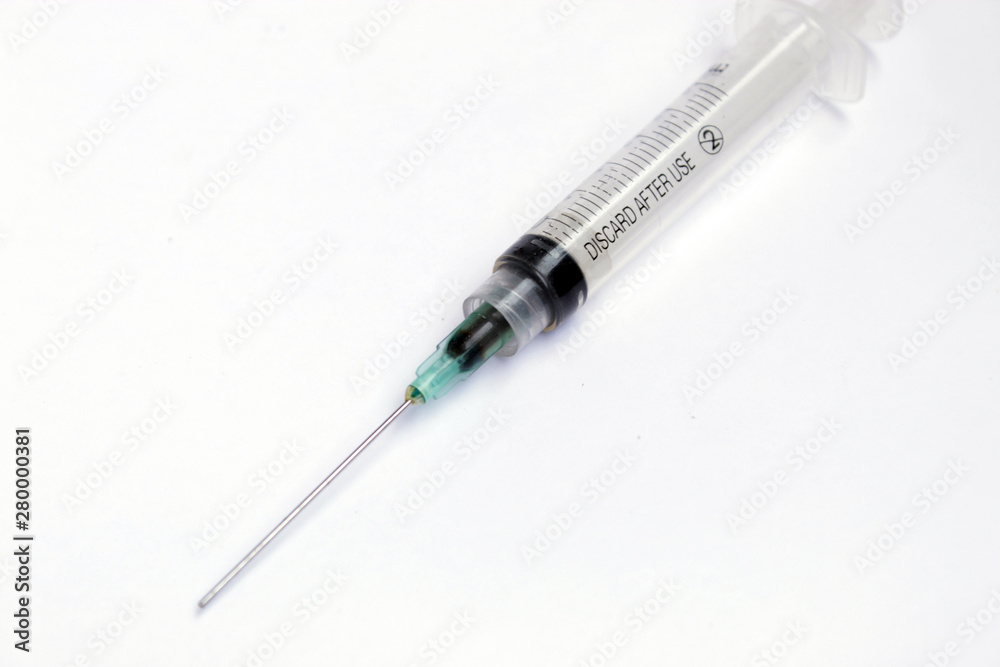 photo of used syringes on isolated background photo of used syringes on isolated background