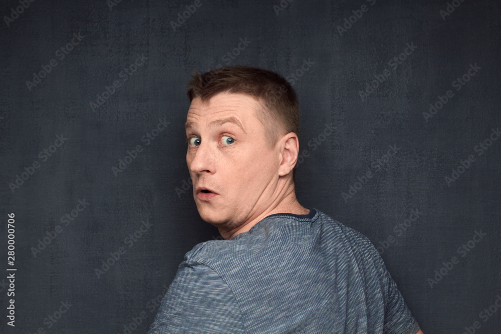 Portrait of confused man taken by surprise
