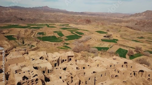 Ruins of old houses in village of Kharanaq in central Iran. Aerial view of the valley, Kharanaq Iran. photo
