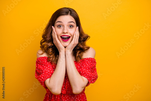 Photo of foxy lady hold arms on cheeks enjoy good news wear off-shoulders dress isolated yellow background