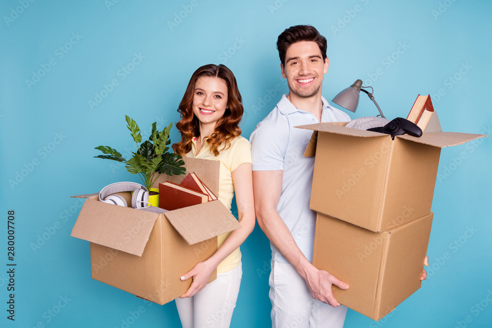 Portrait of his he her she nice attractive lovely cheerful cheery confident people carrying big large boxes packages isolated over bright vivid shine blue green background - obrazy, fototapety, plakaty 