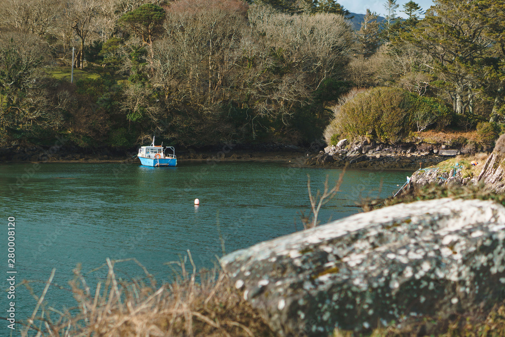 Fototapeta premium motor boat at lake shore