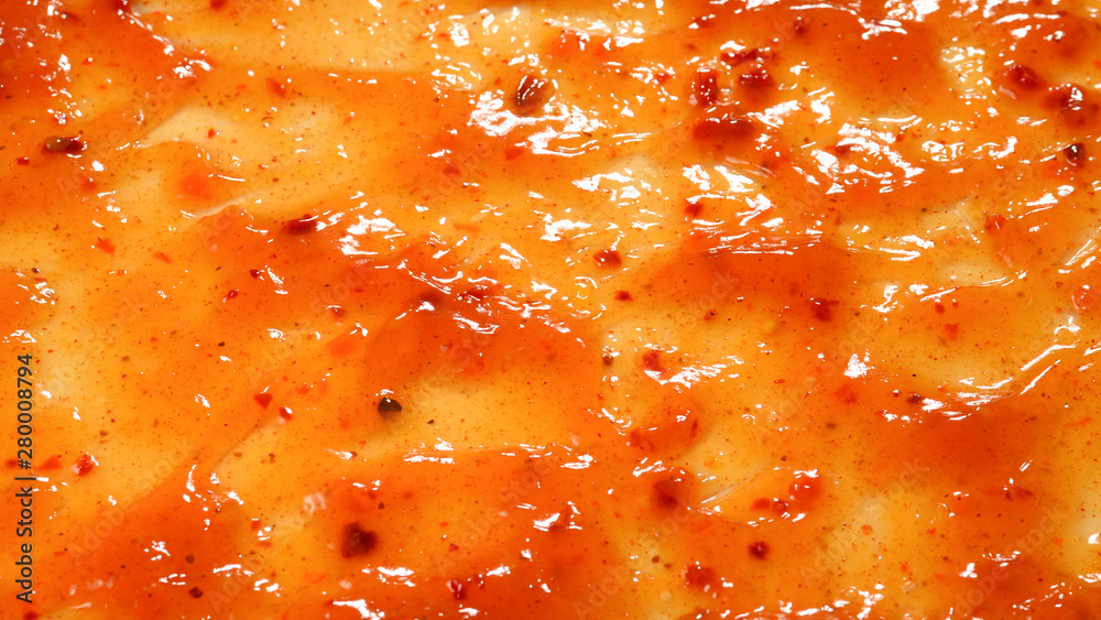 Orange sauce splashes as a background. Orange sauce splashes as a background.