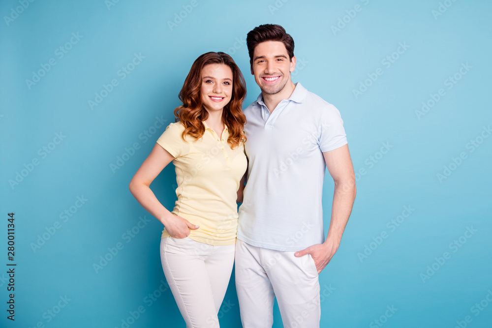 Photo of two pair people lovely look perfect toothy beaming smile hugging each other wear casual t-shirts isolated blue background Photo of two pair people lovely look perfect toothy beaming smile hugging each other wear casual t-shirts isolated blue background