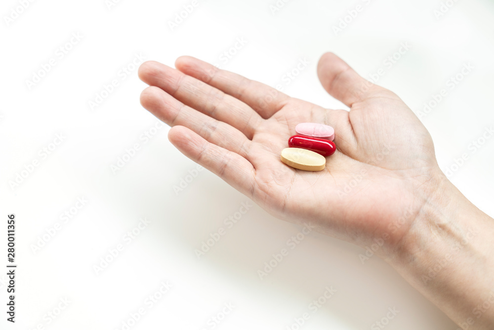 Vitamins supplements on woman hand, Vitamins supplements on woman hand,
