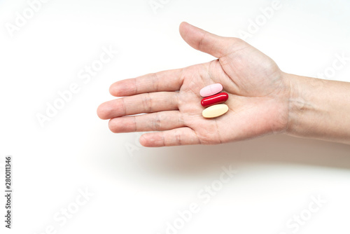 supplements on woman hand