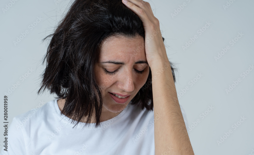 Portrait of sad and hopeless woman. Isolated in white background. Human expressions and emotions Portrait of sad and hopeless woman. Isolated in white background. Human expressions and emotions