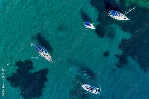 Aerial view of sail boats in front of Aliki beach at Thassos island, Greece © ververidis