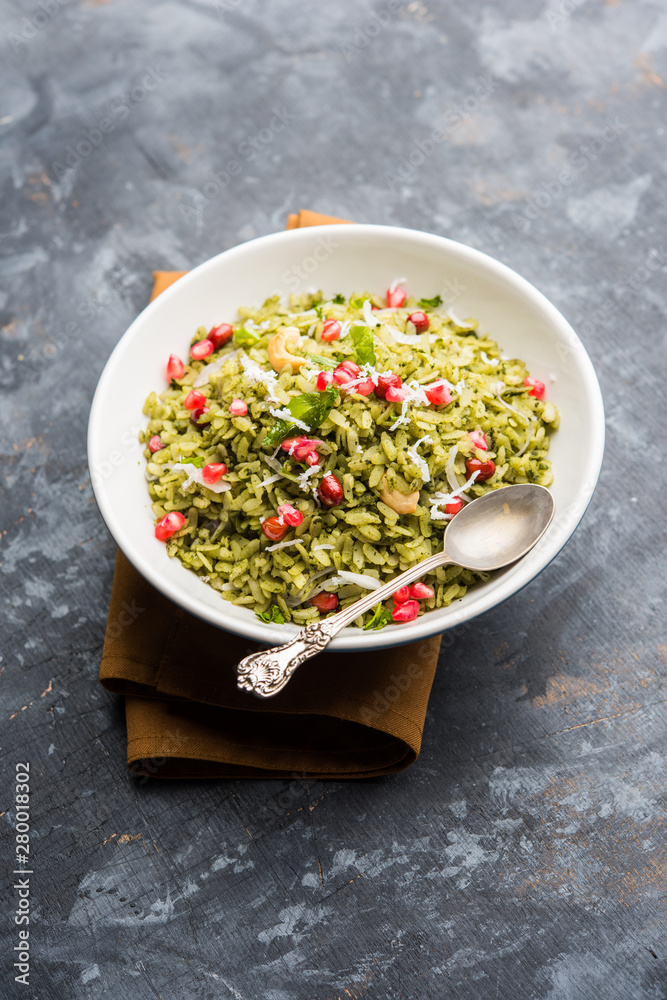Hariyali Poha / Green Masala Pohe or flattened rice served in a bowl, selective focus Hariyali Poha / Green Masala Pohe or flattened rice served in a bowl, selective focus