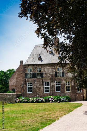 Castle Hernen with path and grass field. Hernen, The Netherlands