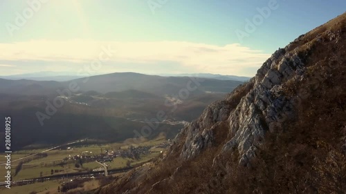 Aerial: Flying arround highest hill in Karst region of Slovenia called Nanos. Filming beautiful country at Slovenian seaside region with drone. photo