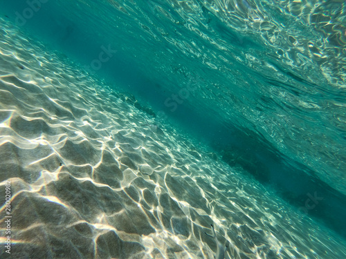 Underwater view of rocks and stones at the bottom of the sea.