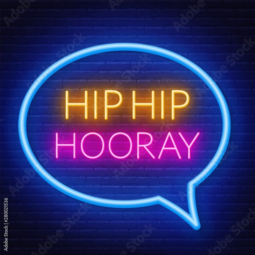 Neon sign hip hip hooray in frame on dark background.