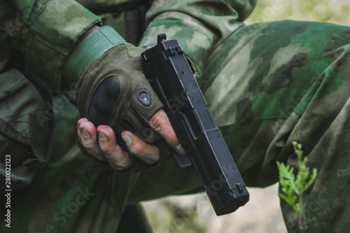 Black green gun pistol on white background