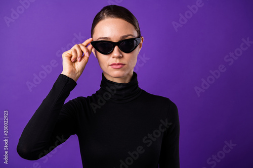 Close up photo of concentrated person wearing black specs turtleneck isolated over purple violet background