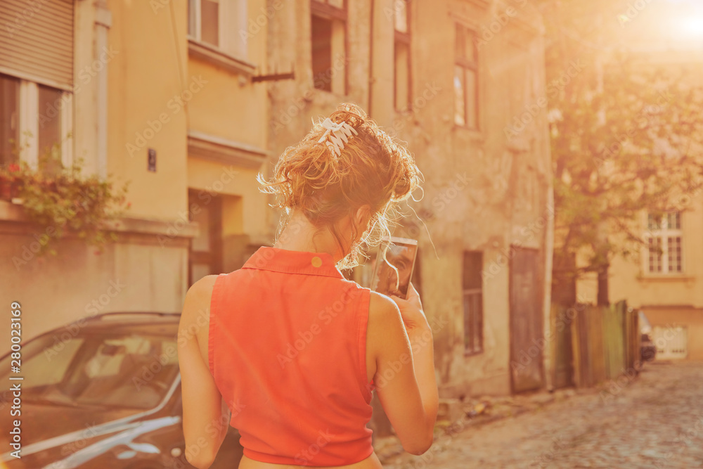Attractive woman using cellphone on the street. Attractive woman using cellphone on the street.