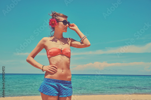 Beautiful woman enjoying on the tropical beach.