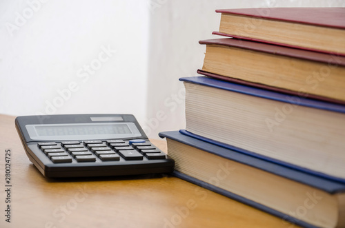 calculator and books on the table