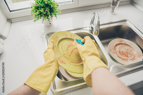 Obraz na plátně Cropped close-up view of her she wearing rubber gloves doing making cleanup serv