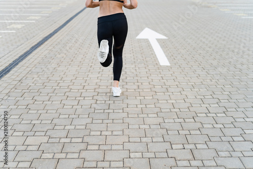 Sport woman running forward