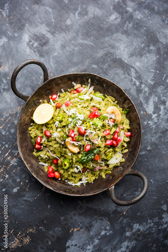 Hariyali Poha / Green Masala Pohe or flattened rice served in a bowl, selective focus