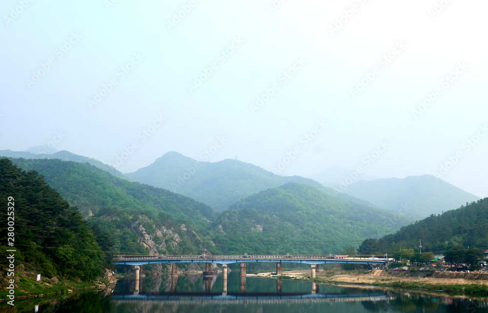 A view of Ganhyeon Bridge reflected upon the Seom river at Wonju, South Korea. A view of Ganhyeon Bridge reflected upon the Seom river at Wonju, South Korea.