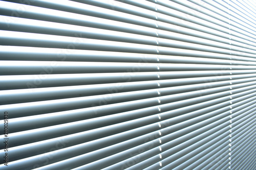 Closed metal blinds, sunlight reflection