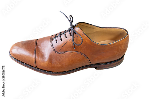 A classic brown oxford shoe with shoelaces isolated on white. Top view.