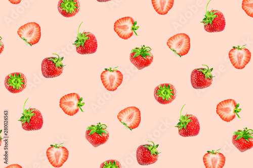Colorful pattern of strawberries on pink pastel background. Top view