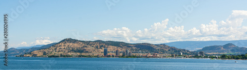 Panoramic view on Kelowna East bank over Okanagan lake on summer day.