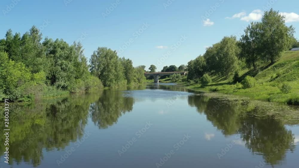 flying on a quadcopter along a beautiful calm river with beautiful banks on a sunny summer day flying on a quadcopter along a beautiful calm river with beautiful banks on a sunny summer day