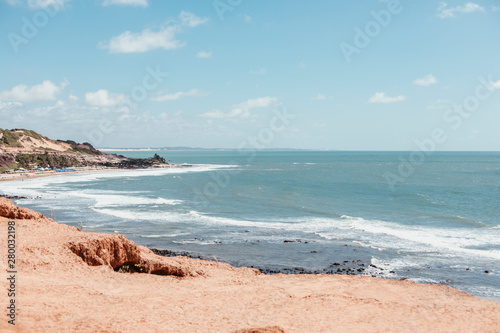 paradise beach without people with hills and palm trees