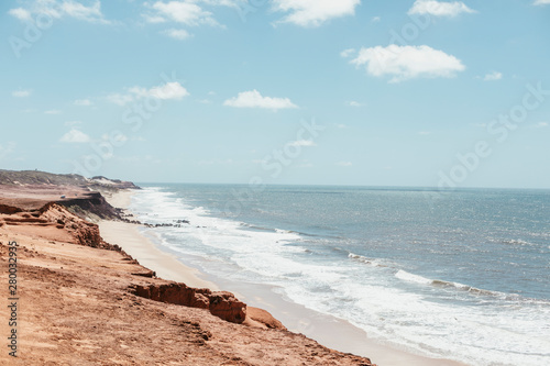paradise beach without people with hills and palm trees