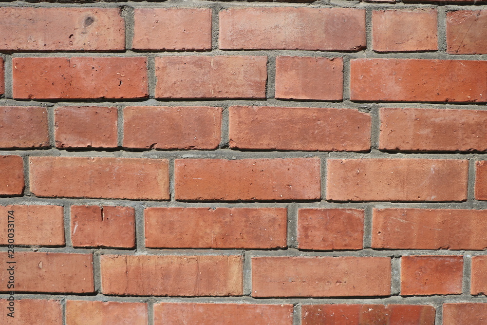Background with an old wall of red bricks, texture and copy space Background with an old wall of red bricks, texture and copy space