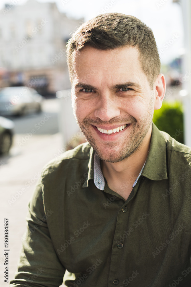 Portrait of smiling young man looking at camera Portrait of smiling young man looking at camera