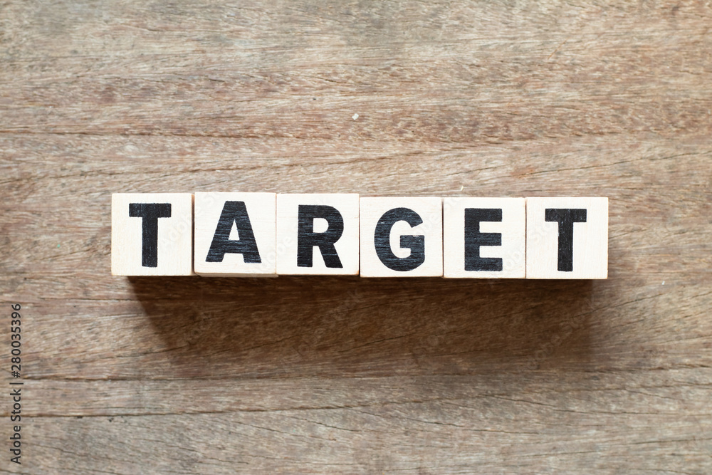 Fototapeta premium Letter block in word target on wood background