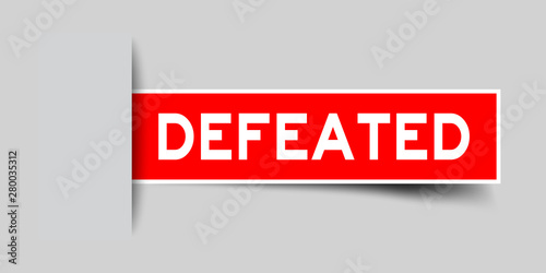 Label sticker red color in word defeated that inserted in gray background
