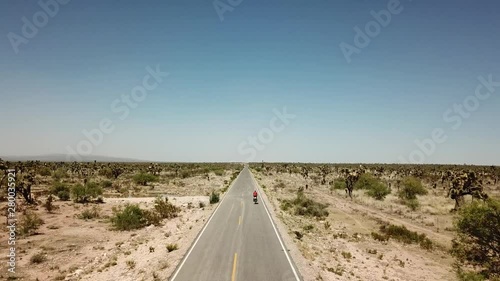 cyclist riding in the desert photo