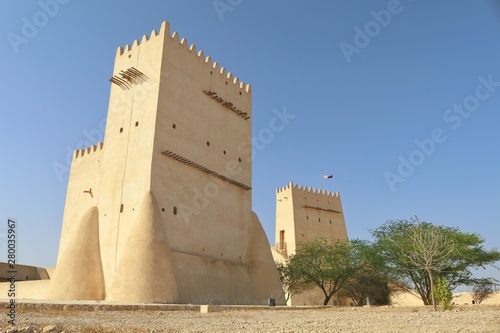View of Barzan Towers(Umm Salal Mohammed Towers) were constructed in late 19th century and rebuilt in 1910 by Sheikh Mohammed bin Jassim Al Thani in Doha, Qatar  photo