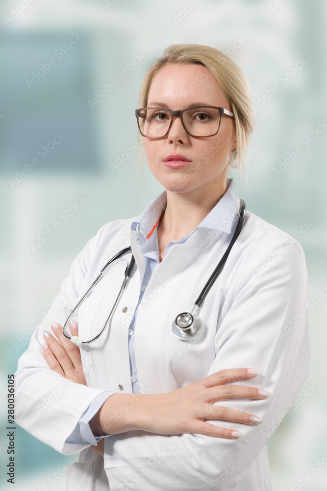 young female doctor in lab coat with stethoscope young female doctor in lab coat with stethoscope