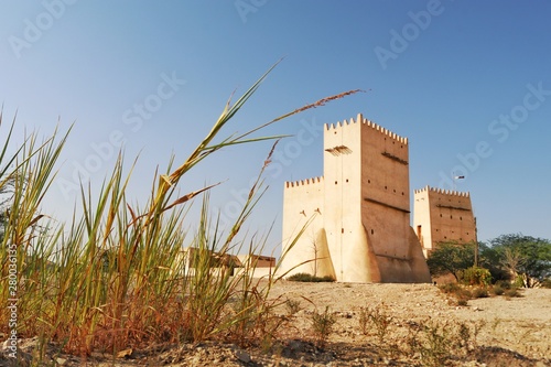 View of Barzan Towers(Umm Salal Mohammed Towers) were constructed in late 19th century and rebuilt in 1910 by Sheikh Mohammed bin Jassim Al Thani in Doha, Qatar  photo
