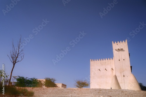 View of Barzan Towers(Umm Salal Mohammed Towers) were constructed in late 19th century and rebuilt in 1910 by Sheikh Mohammed bin Jassim Al Thani in Doha, Qatar  photo